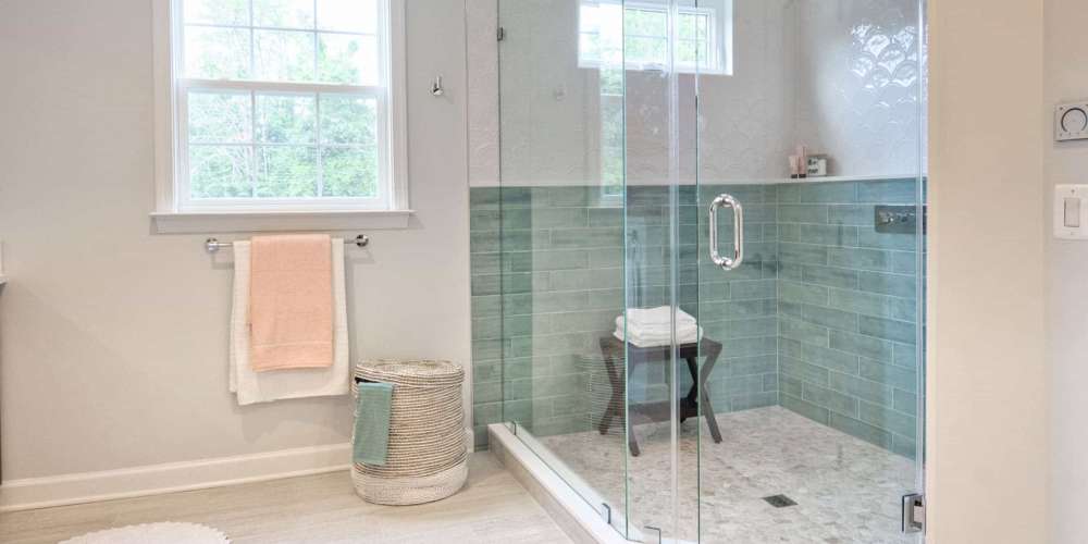 The interior of a modern bathroom with a shower box